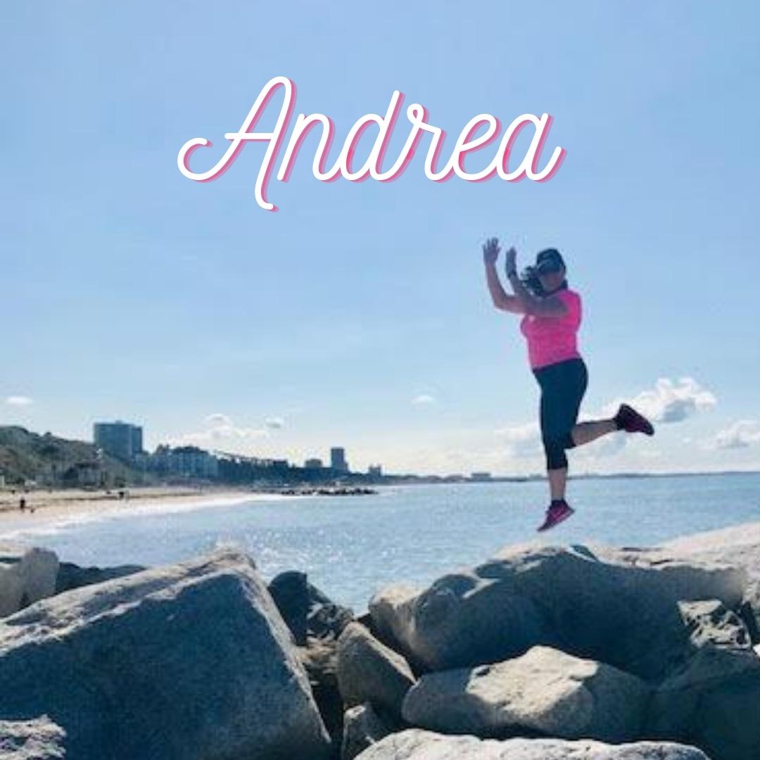 Andrea jumps joyously at the beach, celebrating her healthy lifestyle.