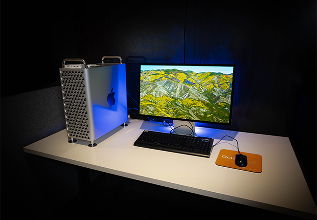 A computer on a desk.