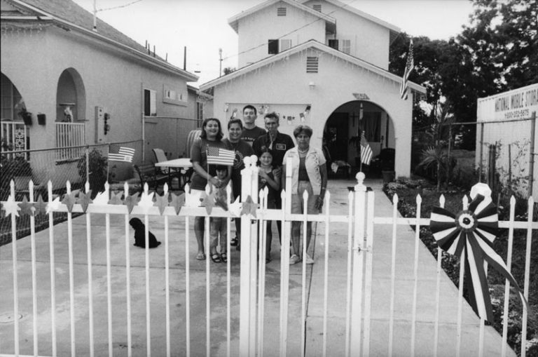 The Cazzara family with dog, flags, stars and ribbons on July 4, 2001, at their home Watts.
