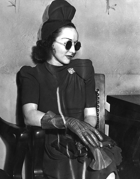 Photograph caption dated May 8, 1940 reads, Red-haired Dolly Dupree age 24