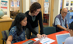 Two women and one man at literacy center