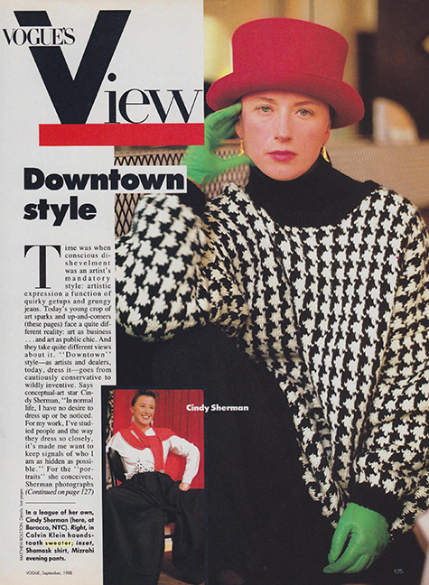 women wearing a red hat and herringbone sweater