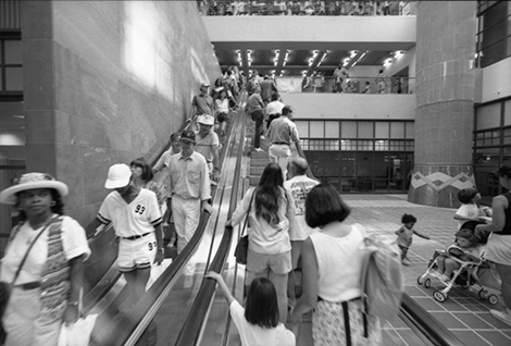 Lines of patrons fill the escalators on Lower Level 1 of the newly expanded Tom Bradley Wing