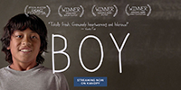 a movie poster featuring a picture of a young smiling 10 year old boy 