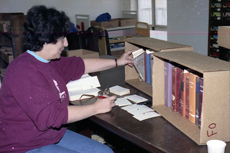 women cleaning books