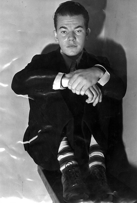  Leroy Drake, 19 seated with hands crossed over his knees