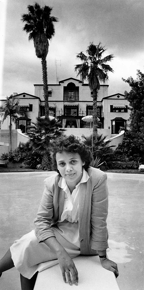 Karen Hudson, granddaughter of Sunset Plaza bungalow complex architect Paul R. Williams, at building's swimming pool