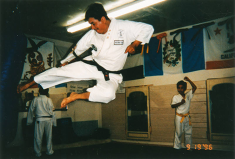 Karate expert Oscar Maldonado performs a flying side kick