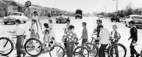 And here they come, kids on bikes