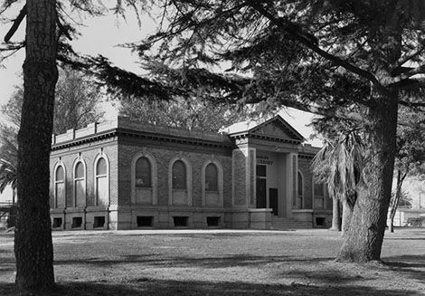 Watts Branch Library as seen through the trees surrounding it.