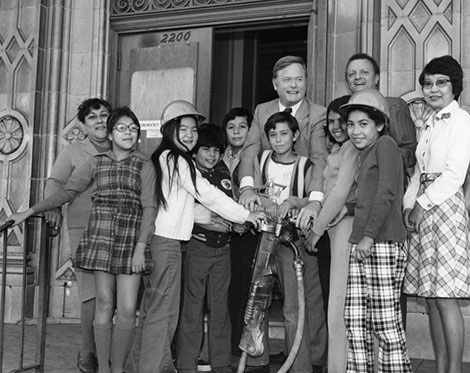 Councilman Art Snyder poses with librarian and library patrons