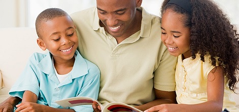family reading a book together