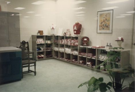 A variety of Save the Books merchandise set up in a lobby