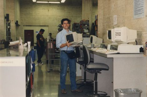 Staff member James Van Gerpen packs up computers for the move