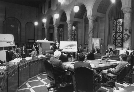 Betty Gay Teoman and Norman Pfieffer are pictured addressing the Board of Library Commissioners