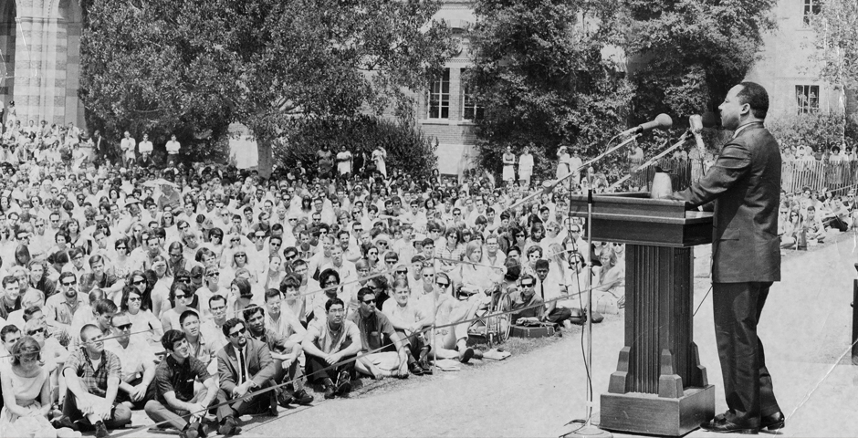 MLK at UCLA podium in front of a crowd of students
