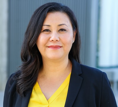 Dr. Suely Saro in a yellow blouse