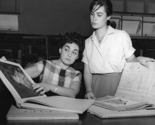 Two women from a film studio search for information at the Hollywood Branch Library