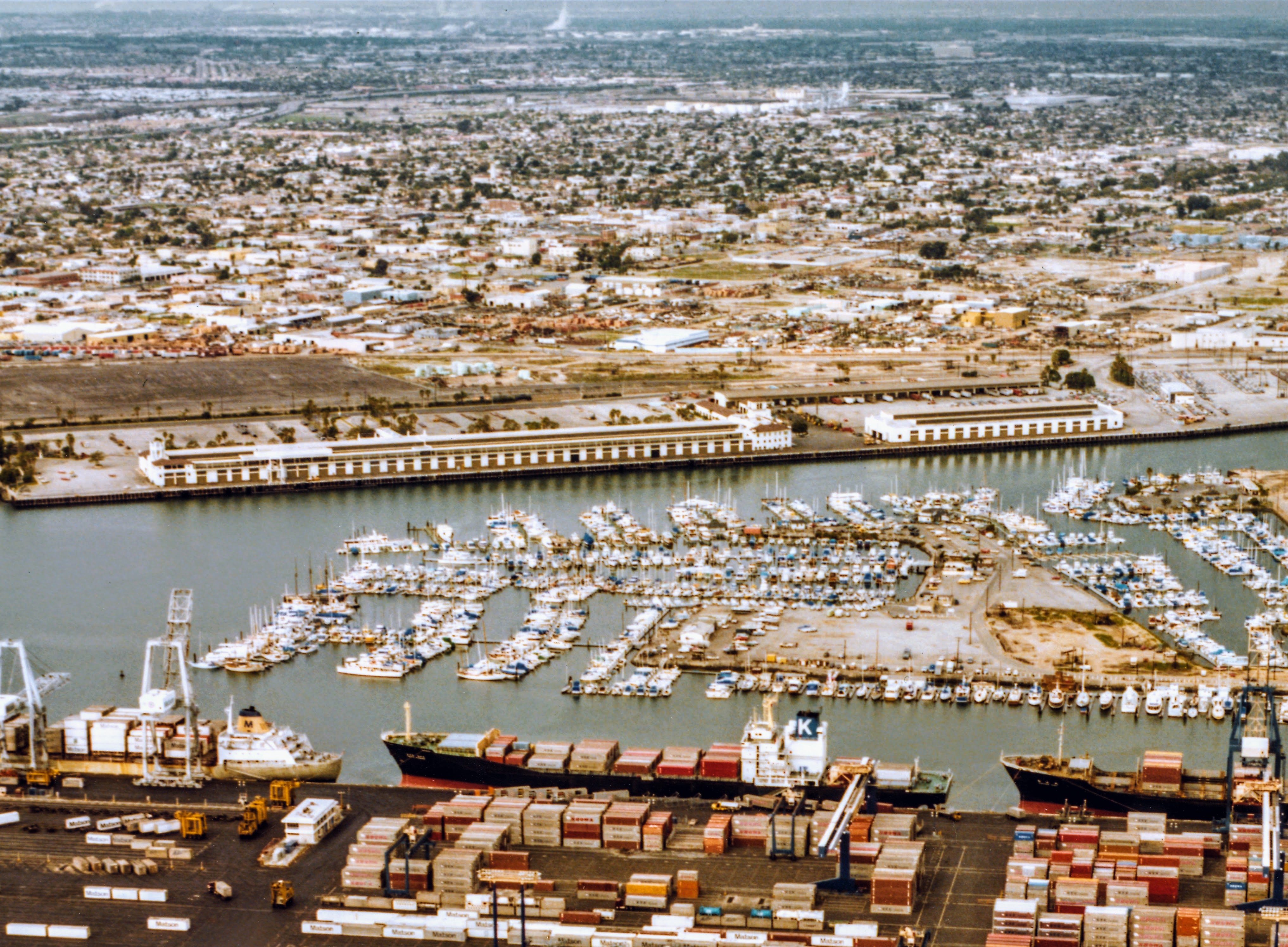 Showing an aerial view of the Matson Terminal as seen from Terminal Island looking across the East Channel ca. 1981