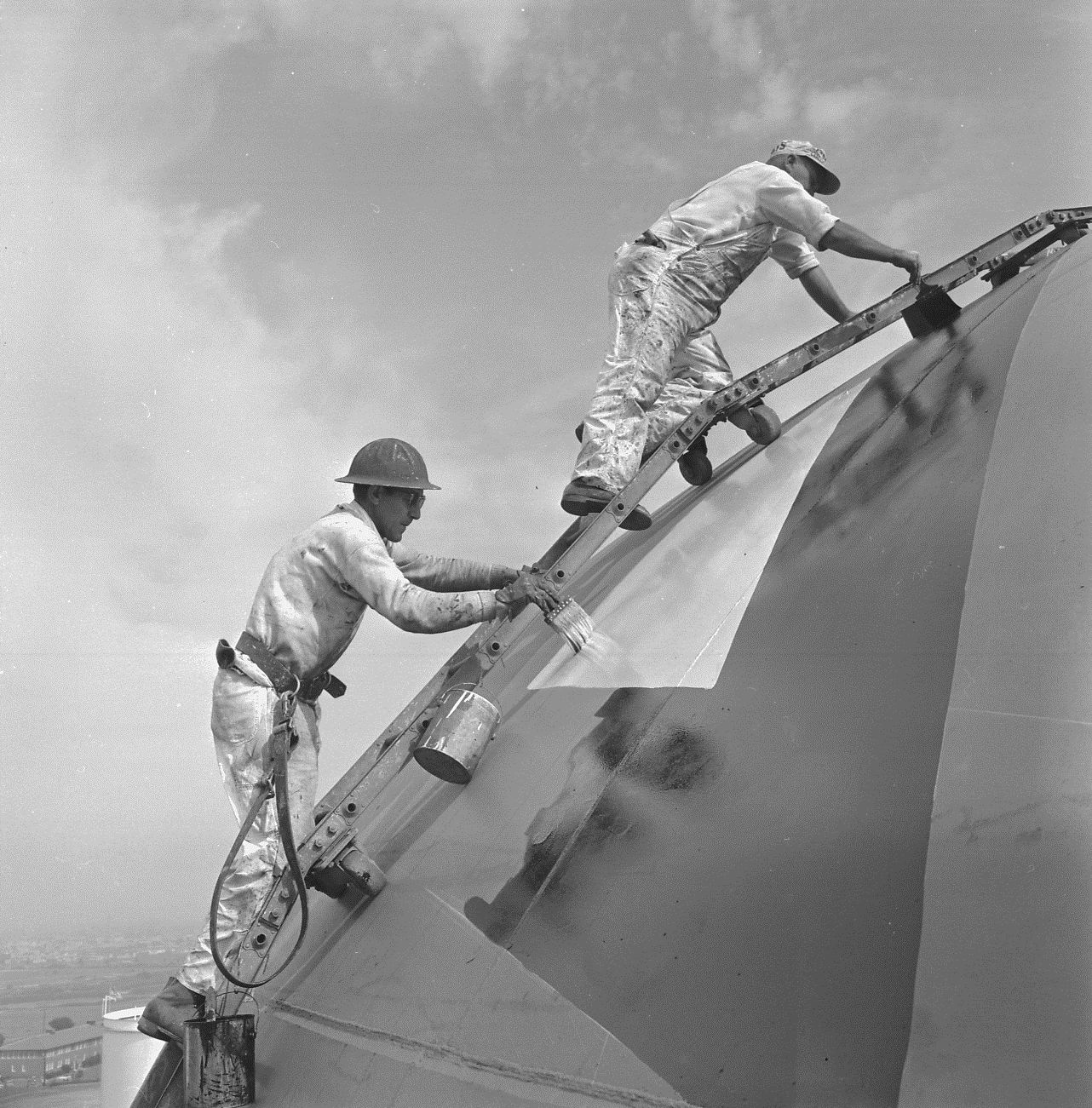 Showing workers painting Jack ca. 1960. Los Angeles Harbor Department. 