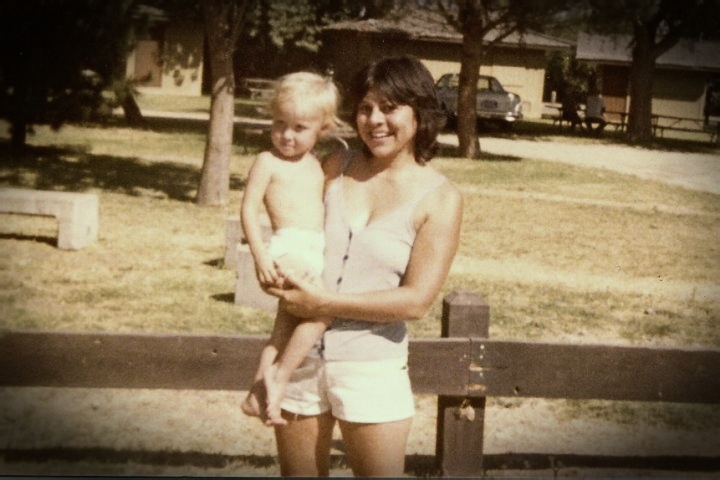 My cousin Marie carrying me sometime in the 1980s
