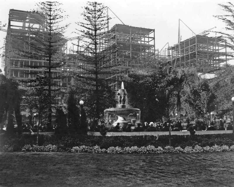 Looking towards the Biltmore during construction with Pershing Square in the foreground with Johan Caspar Lachne Gruenfeld's cherub fountain at the center