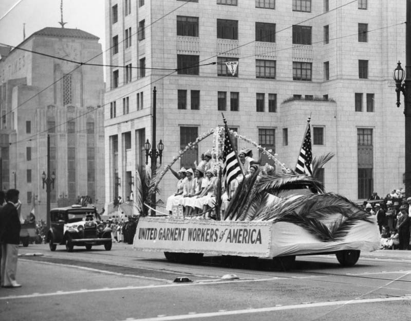 Workers representing the United Garment Workers of America travel down Spring Street in Los Angeles, 1936