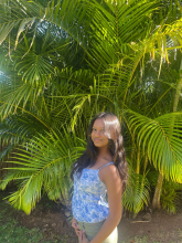 Raga in front of palm trees