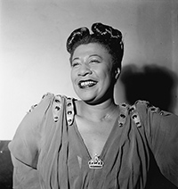 an old vintage photo of Ella Fitzgerald smiling