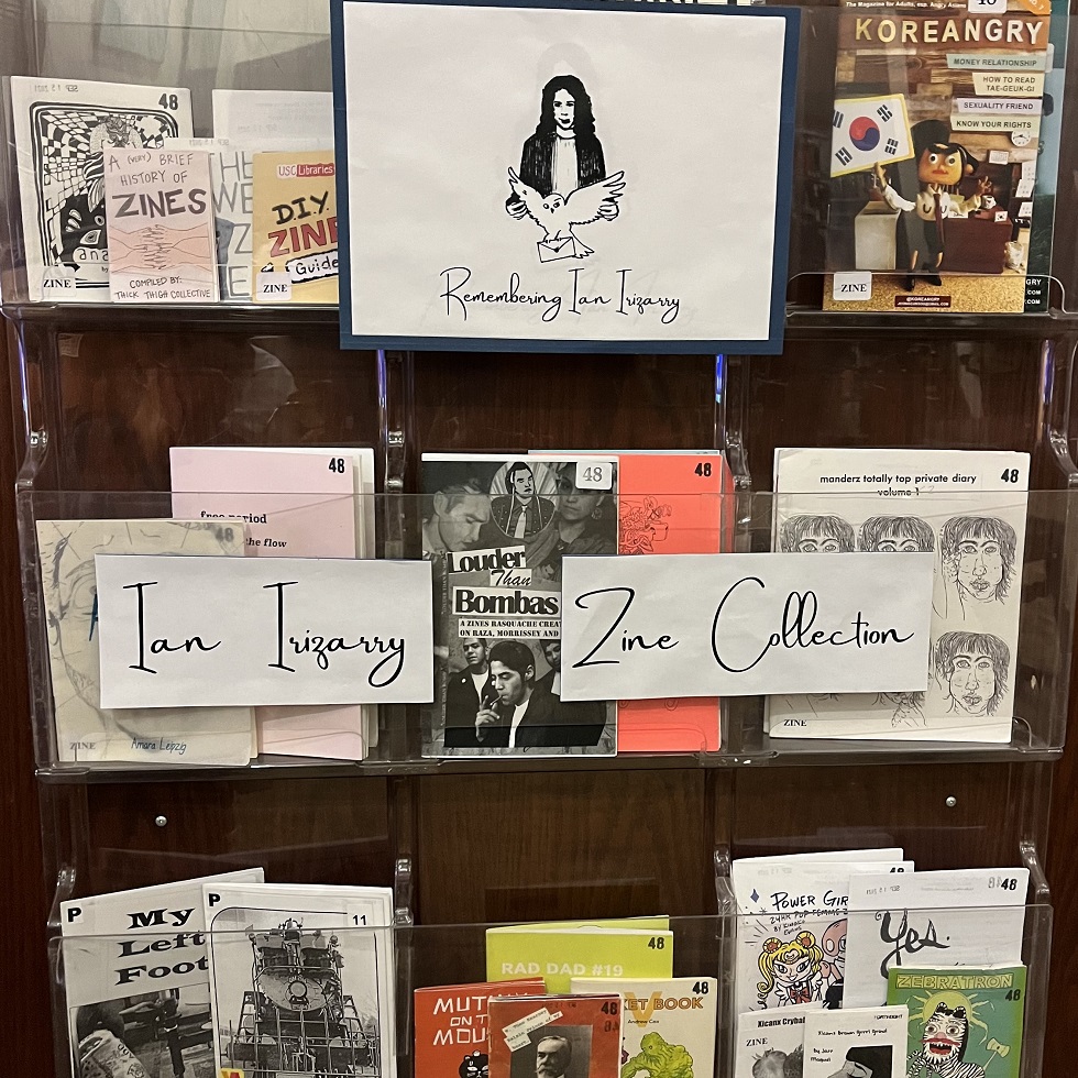 zine collection on a shelf