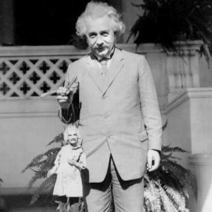 albert einstein holding a puppet of himself