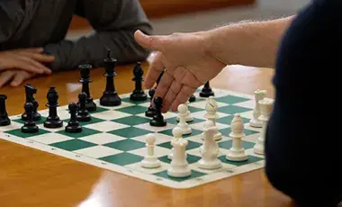 chess board with two players playing 