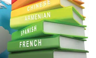 Stack of language books, including French.