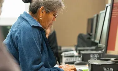 Senior at computer