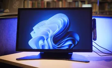 A computer monitor on a desk