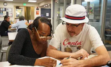 tutor with adult learner