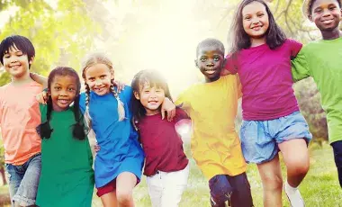 Children of different ages are happy together outdoors