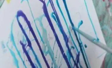 dripping paint on a canvas