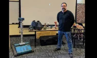 Man surrounded by robots