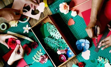 picture of various crafts and hands touching them