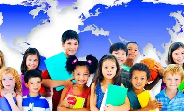 Kids holding books with a worldmap as a background