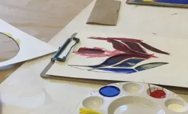 stencils and paint for creating a lucha libre mask on a table