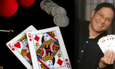Photo of performer Magic Wayne along with some of his magic props.