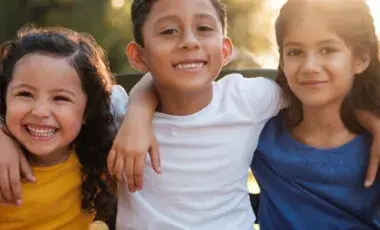 three children smiling
