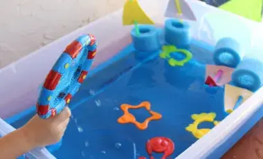 Bin with water and sensory toys