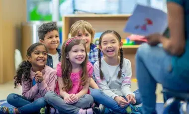  A story is being read to children.