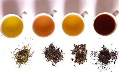 Photos of four brewed teas next to the original tea leaves. 