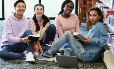 Teens studying in the library
