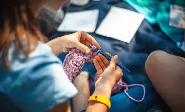 Close up of a woman crocheting