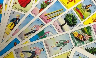 Loteria boards fanned out across a table. 